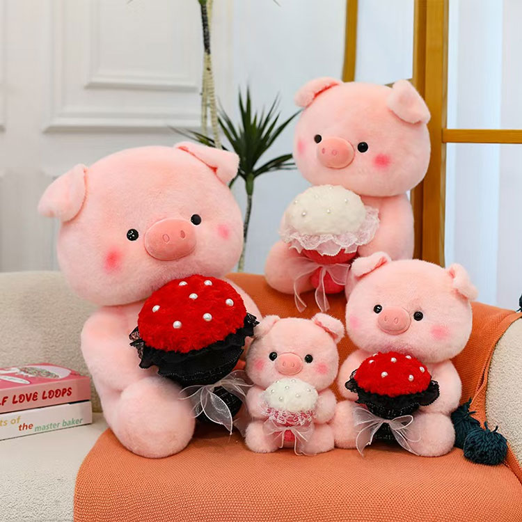 Peluche cochon rose tenant des fleurs